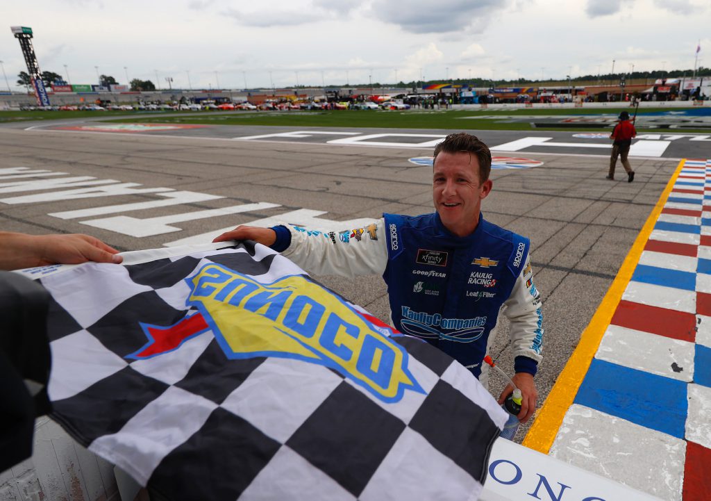 HAMPTON, GEORGIA - JUNE 06: AJ Allmendinger, driver of the #16 C2 Freight Resources Chevrolet, takes the checkered flag after winning the NASCAR Xfinity Series EchoPark 250 at Atlanta Motor Speedway on June 06, 2020 in Hampton, Georgia. (Photo by Kevin C. Cox/Getty Images)